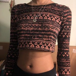 Pink and black patterned long sleeve crop top